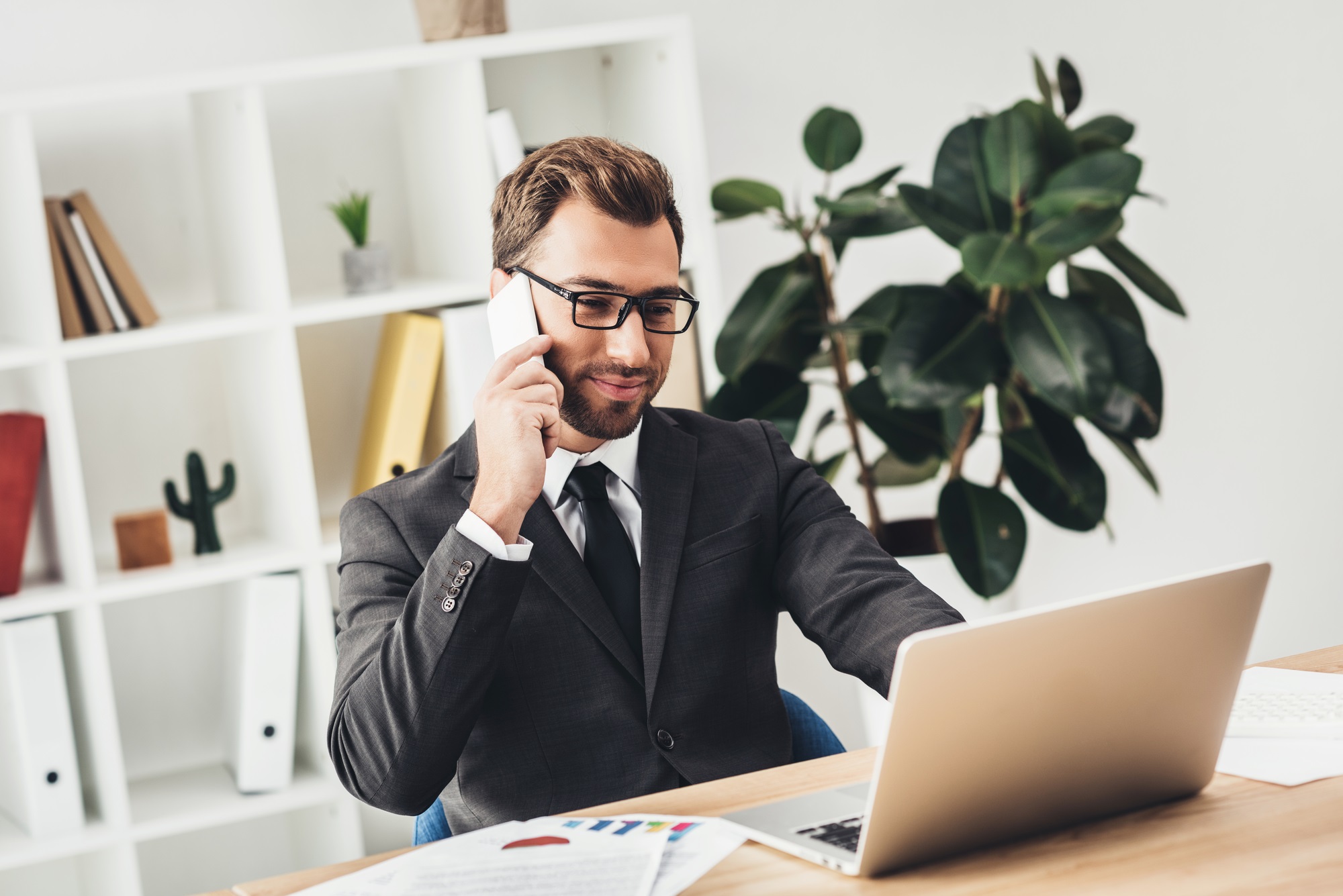 A businessman working on SaaS integration in his office.